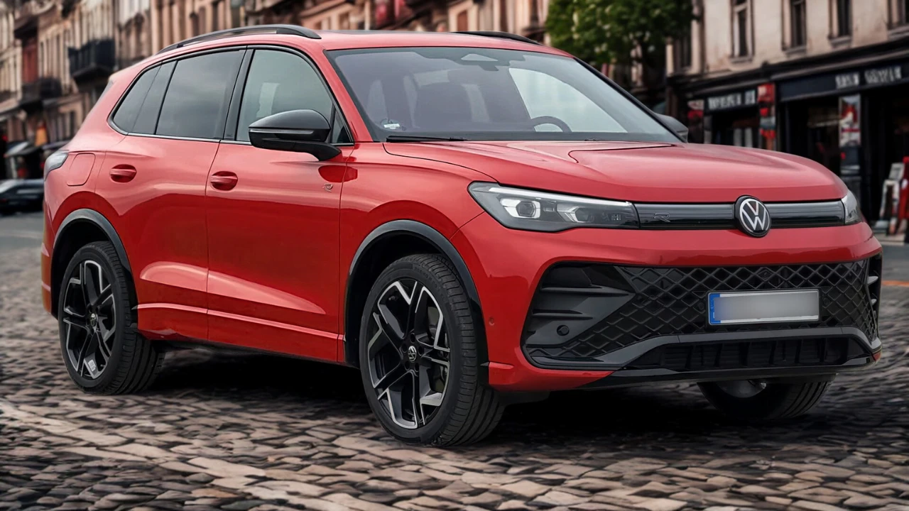 Driekwart voorkant zicht van rode 2025 Volkswagen Tiguan op kinderkopjes straat met moderne design elementen en lichtmetalen wielen