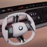 Het futuristische cockpitontwerp van BMW's Neue Klasse met het pilaar-tot-pilaar display en herontworpen stuurwiel