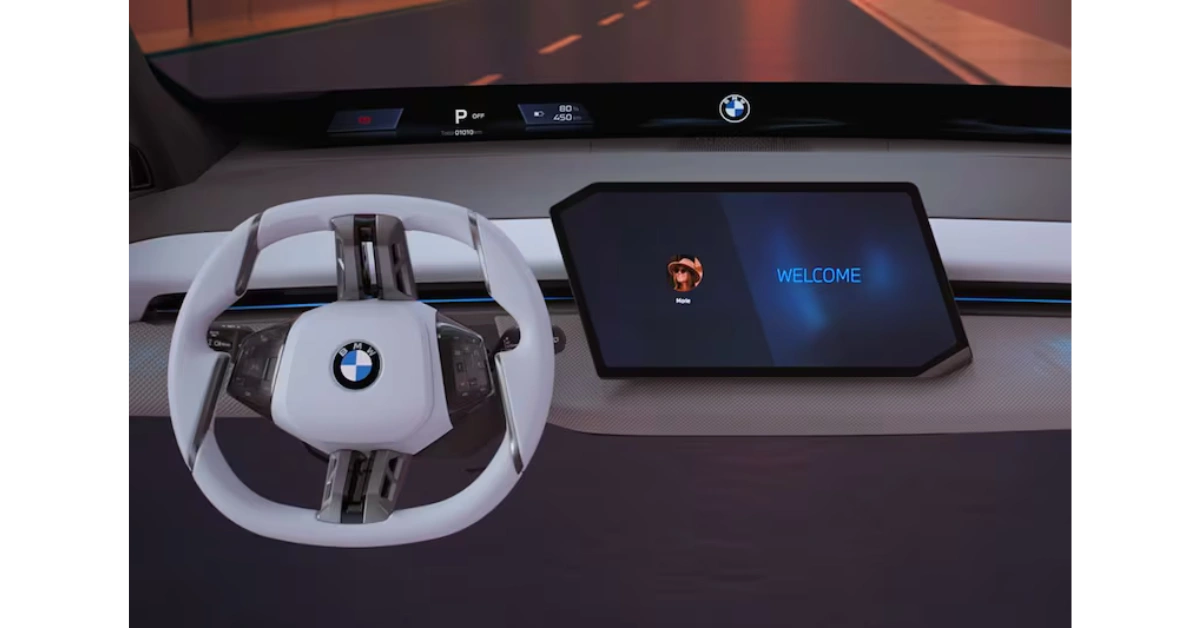 BMW's nieuwe Panoramische iDrive-systeem met het minimalistische witte stuurwiel en welkomstscherm op het centrale display