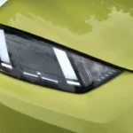 Gedetailleerde macro weergave van 2025 BYD Dolphin Surf LED-koplamp met interne lichtelementen en geavanceerd optisch ontwerp