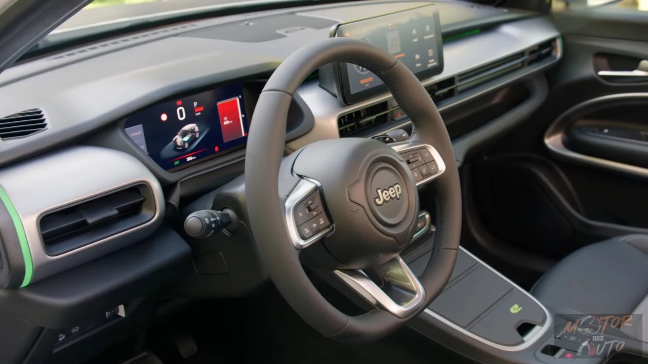 Interieur dashboard van de 2025 Jeep Avenger met dubbele 10.25-inch schermen voor infotainment en digitaal instrumentenpaneel met draadloze Apple CarPlay en Android Auto.