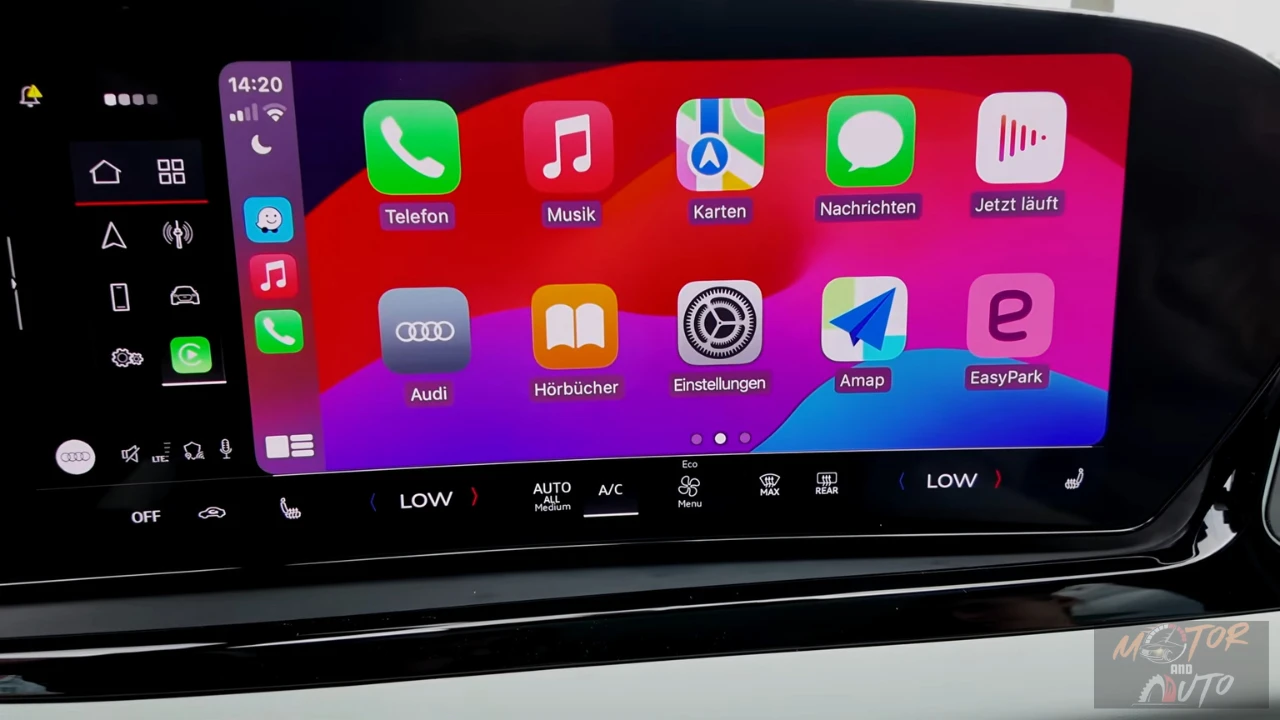 Centrale touchscreen van 2026 Audi A6 met Apple CarPlay interface, app-iconen, klimaatcontrolepaneel en geïntegreerde smartphone-connectiviteitsfuncties