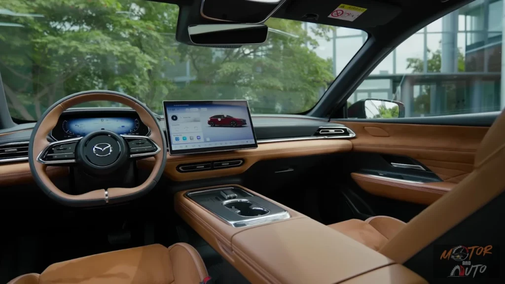 2026 Mazda 6e interieur dashboard overzicht met tan lederen stuurwiel, 14,6-inch centraal touchscreen, digitaal instrumentencluster, en premium houtnerf-afwerking in Takumi Plus specificatie