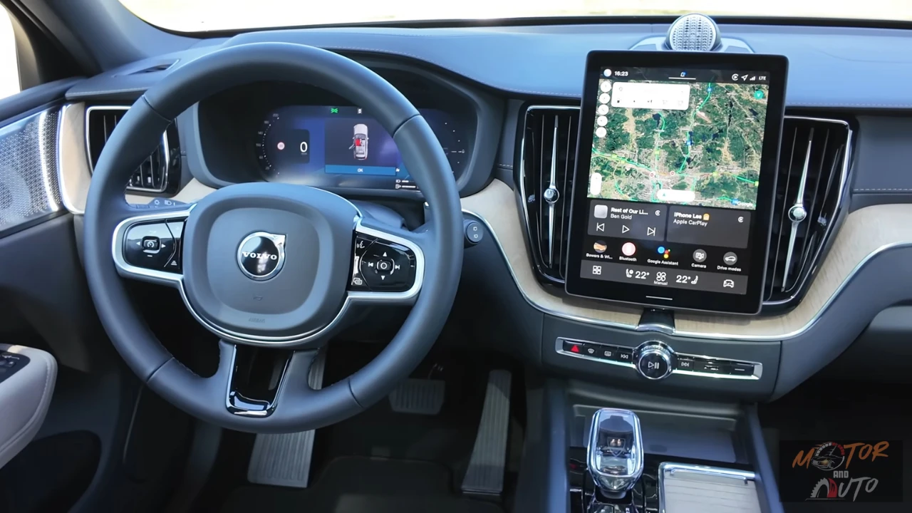 2026 Volvo XC60 infotainment touchscreen met Google Maps, klimaatbediening interface en geavanceerde connectiviteitsvoorzieningen met kristallen versnellingspook zichtbaar
